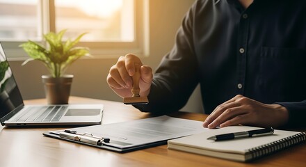 Approving Documents: Man Stamping Legal Papers in Bright Office Setting