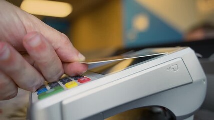 NFC credit card payment. Paying with contactless credit card with NFC technology. Wireless money payment - Powered by Adobe