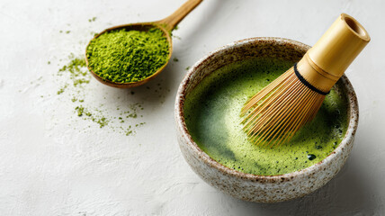 Stirring matcha tea with bamboo whisk, clean aesthetic