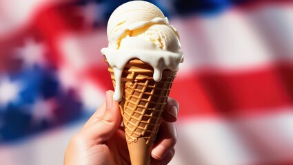Hand holding vanilla ice cream cone with american flag in background for patriotic celebration