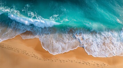 footprints on beach shoreline with turquoise ocean, footprints on beach and wave foam, footprints on beach at ocean edge