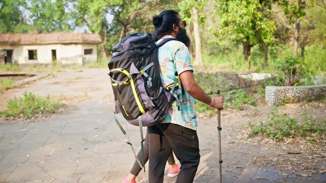Couple Walks Forest Trail in Casual Adventure Gear