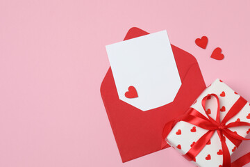 gift boxes, hearts on pink background with space for text