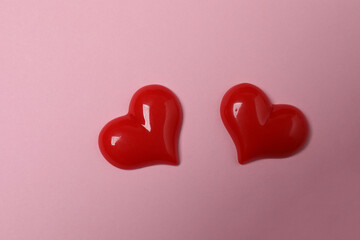 gift boxes, hearts on pink background with space for text