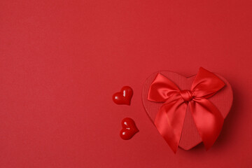 gift boxes, hearts on red background with space for text