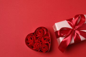 gift boxes, hearts on red background with space for text