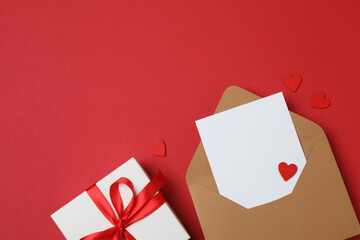 gift boxes, hearts on red background with space for text