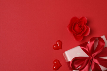 gift boxes, hearts on red background with space for text