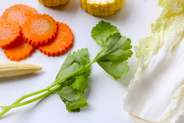 A fresh mix of vegetables prepared for suki or hot pot cooking.