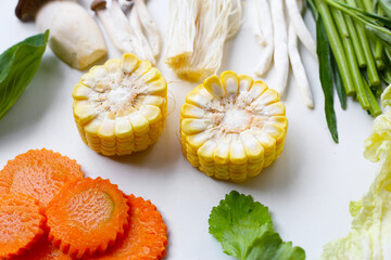 A fresh mix of vegetables prepared for suki or hot pot cooking.