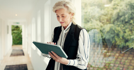 Business, woman and reading on tablet at house for research, email client and selling property. Mature realtor, digital or web for real estate sales, review information and schedule viewing of rental