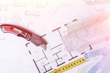 Building plan. Linoleum and flooring installation tools. Repair in the house..