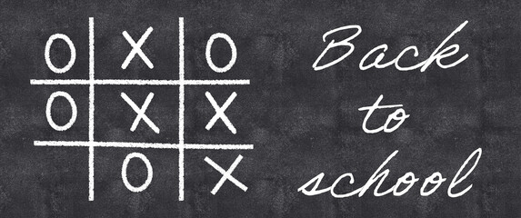 Back to school banner with tic-tac-toe game played on the blackboard