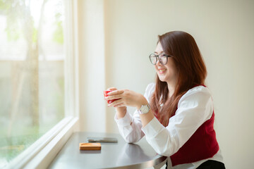 Close-up beautiful happy Smiling of hands Holding cup mug of Hot coffee latte wits business female...