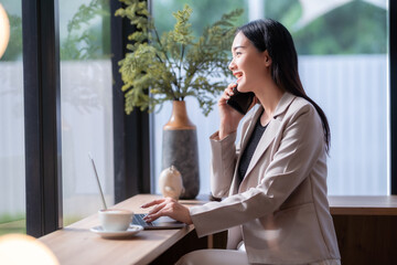 asian freelance people Beautiful business female talking making using casual working with laptop...