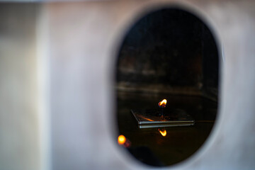 lamp pay Candles to pay homage to Buddha for worship with faith to Buddha statue in temple thailand...