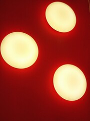 red light bulb Modern Minimalist Ceiling Lights on Vibrant Red Background