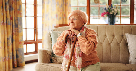Walking stick, happy and senior woman in home with nostalgia, retirement or remember memory. Relax,...