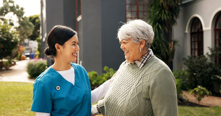 Happy, outdoor and nurse with senior woman for fresh air, wellness and talking in nursing home....