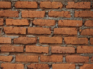 Fototapeta premium A close up view of red brick wall
