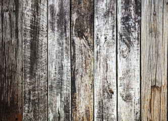 The image is a close up of a wooden surface with a grainy texture