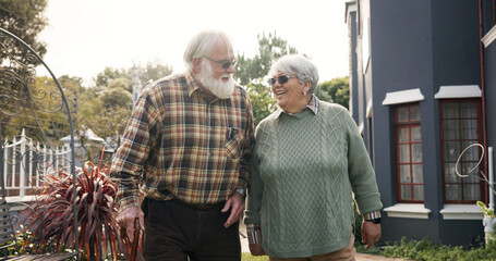 Happy, outdoor and senior couple walking and holding hands for fresh air, bonding and relax in...