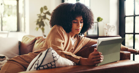 African woman, reading and tablet at house for email, design feedback and project schedule. Graphic...