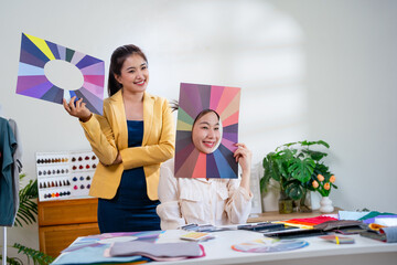 Color frames ,Face frames. Asian stylist conducts a color type procedure for a young woman.personal...