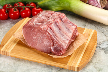 Raw pork loin cut with bone