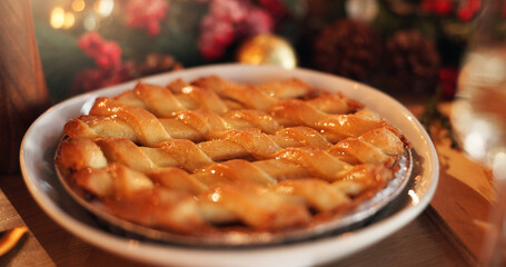 Christmas, holiday and apple pie on table for festive dessert, tradition and celebration. Sweet...