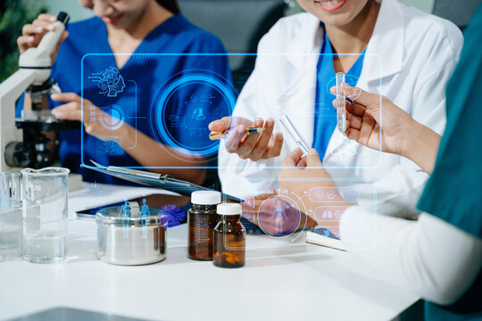 Medical scientists collaborate in a modern lab, using AI and digital holograms to analyze data, experiment