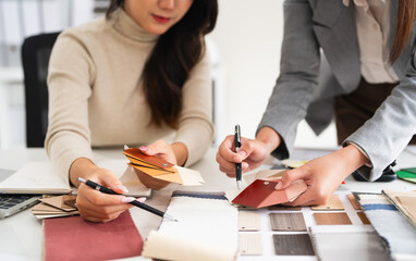 Close up on hands of Professional interior designer teamwork planning for house project working...