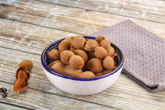 Tropical exotic Tamarind fruit heap