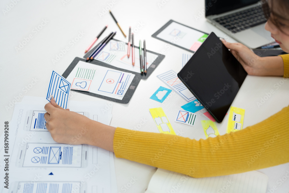 Poster female ux developer and ui designer , mobile app interface wireframe design. app developer working a