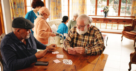 Senior men, friends and playing cards in homecare for contest, friendly competition and hobby....