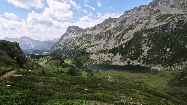 High-Altitude View of Lago di Devero Nestled Beneath Punta della Rossa in Alpe Devero Natural Park, Piedmont Alps, Italy