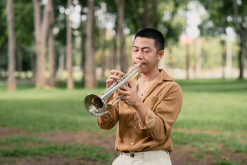 Trumpet player performing with closed eyes, immersed in music in a peaceful park