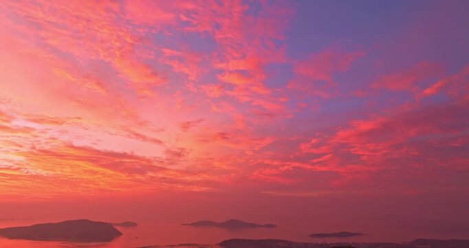 aerial view of colorful cloud above the Phuket Ocean. Clouds are moving slowly in stunning sunset video 4K. Nature video High quality footage Scene of Colorful romantic sky sunset background.