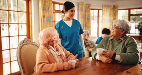 Nursing home, caregiver and old women with coffee, chat and conversation for healthcare or...