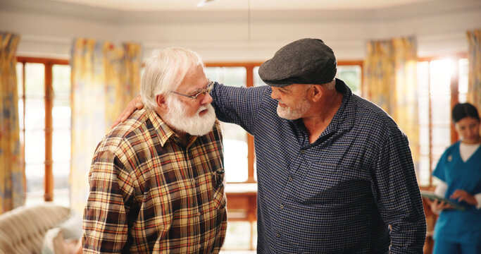 Nursing home, senior men and friends with smile, conversation and bonding together in living room. Pensioners, group or old people in lounge, discussion and retirement with memory, support or talking