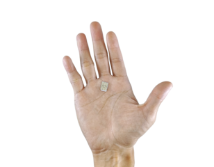 A small, square patch rests gently in an open palm.