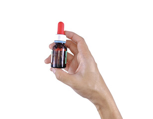 Medical dosage tool for children’s syrup held in human hand, suitable for healthcare concept visuals