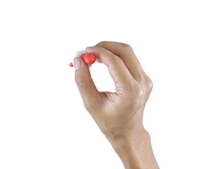 Close-up of a hand gripping a pediatric syrup dropper, commonly used for child medication