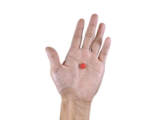 Conceptual image of blood health and supplementation, showing hand gripping a pack of hematinic tablets.