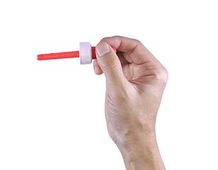 A hand holding a red liquid medicine dropper for children, isolated on white background