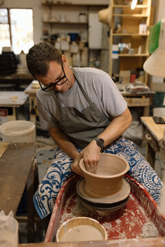 Artist in Ceramics and Pottery Studio working