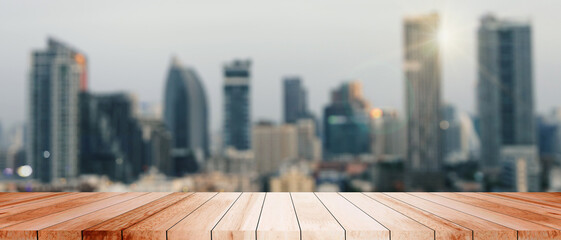 Wood tabletop cityscape metropolis evening skyscrapers buildings illuminate urban lights panorama modernity residential sun lights downtown morning skyscraper reflection contemporary office atmosphere