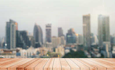 Wood tabletop cityscape metropolis evening skyscrapers buildings illuminate urban lights panorama modernity residential night lights downtown skyscraper reflection contemporary atmosphere.