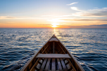 A lone wooden boat drifts calmly on the serene sea at sunset, under an orange sky
