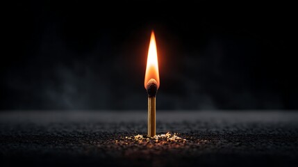 Ignition concept centered flame of a burning matchstick fire closeup in a minimalist background